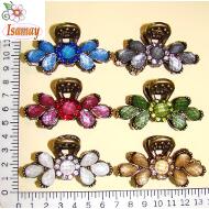 PINZA BRONCE FLOR COMPUESTA POR PIEDRAS ACRILICAS COLOR