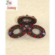 PINZA COBRE 3 OVALOS HUECOS CON PIEDRAS ROJAS